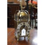 An early 20th century brass 'lantern clock' mantel timepiece,