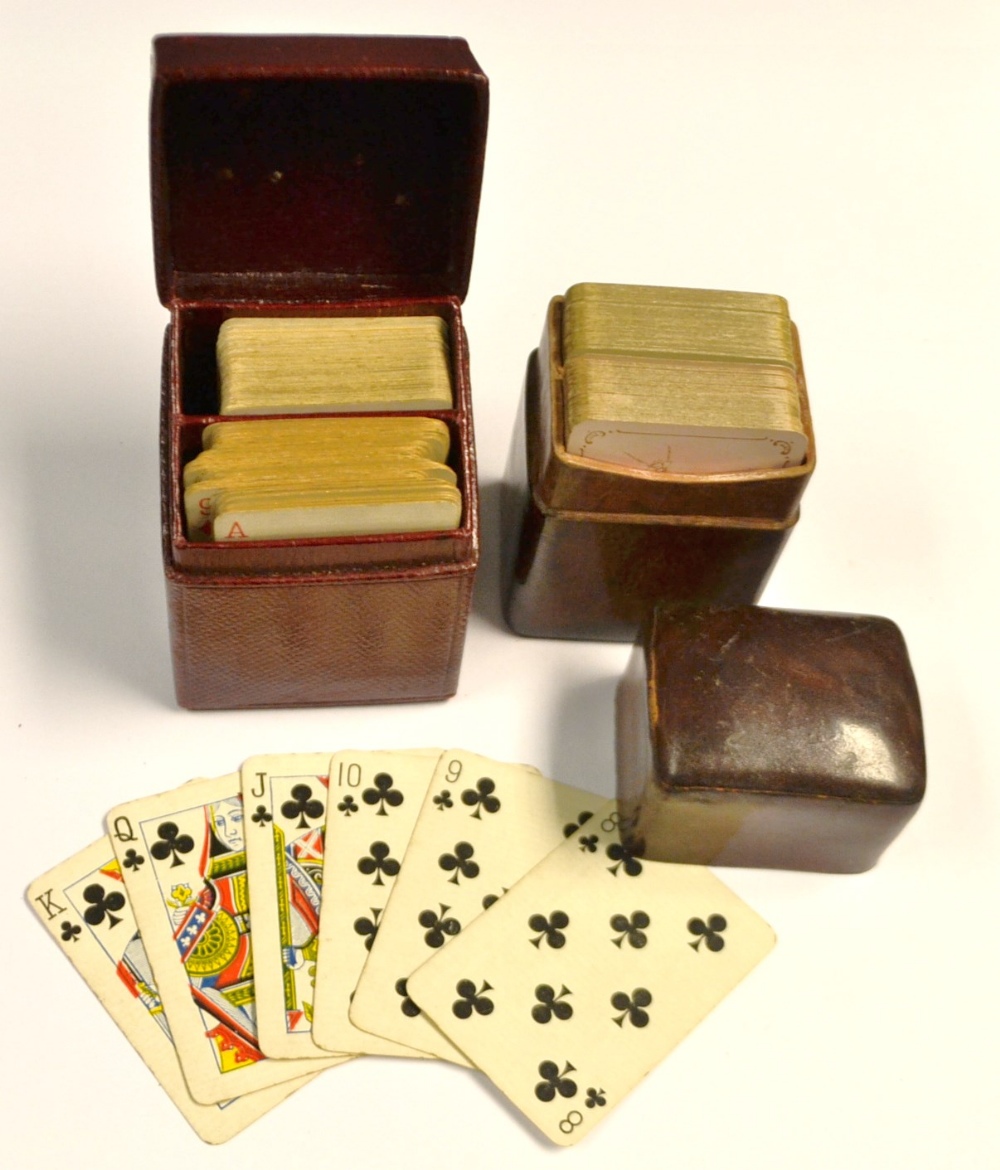 An Edwardian set of patience playing cards, Morocco case; another set similar,