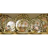 A Royal Crown Derby 2451 part tea and dinner service, including three dinner plates,