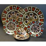 Royal Crown Derby - a pair of 1128 Imari dinner plates; a pair of side plates; a cup and saucer,