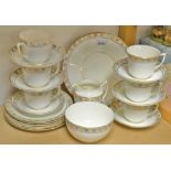 A late Victorian six setting tea service comprising bread and butter plate, six cups and saucers,