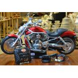 A scale model Harley Davidson remote control motor cycle, with charger,