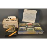 A die-cast model Ambulance, boxed with certificate; a commemorative desk weight,