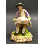 A 19th century Minton figure, of a shepherd boy shearing a sheep,