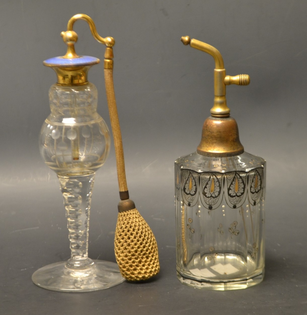 An enameled cut glass perfume bottle;