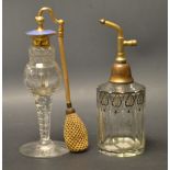 An enameled cut glass perfume bottle;