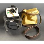 Cameras - a Polaroid 1000 Land camera, flashes,