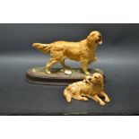 A Royal Doulton model of a Golden Retriever at rest with a playful puppy, black printed mark, c.