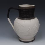 A large Adams stoneware jug, in relief with Bacchantic infants, ribbed dark brown neck and foot rim,