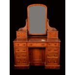 A Maple & Co mahogany dressing table, arched mirror and four small drawers to superstructure,