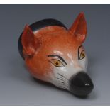 An English pottery novelty stirrup cup, modelled as a fox mask, naturalistically painted, 13cm long,