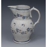 A 18th century Prattware jug, relief moulded with leaves,