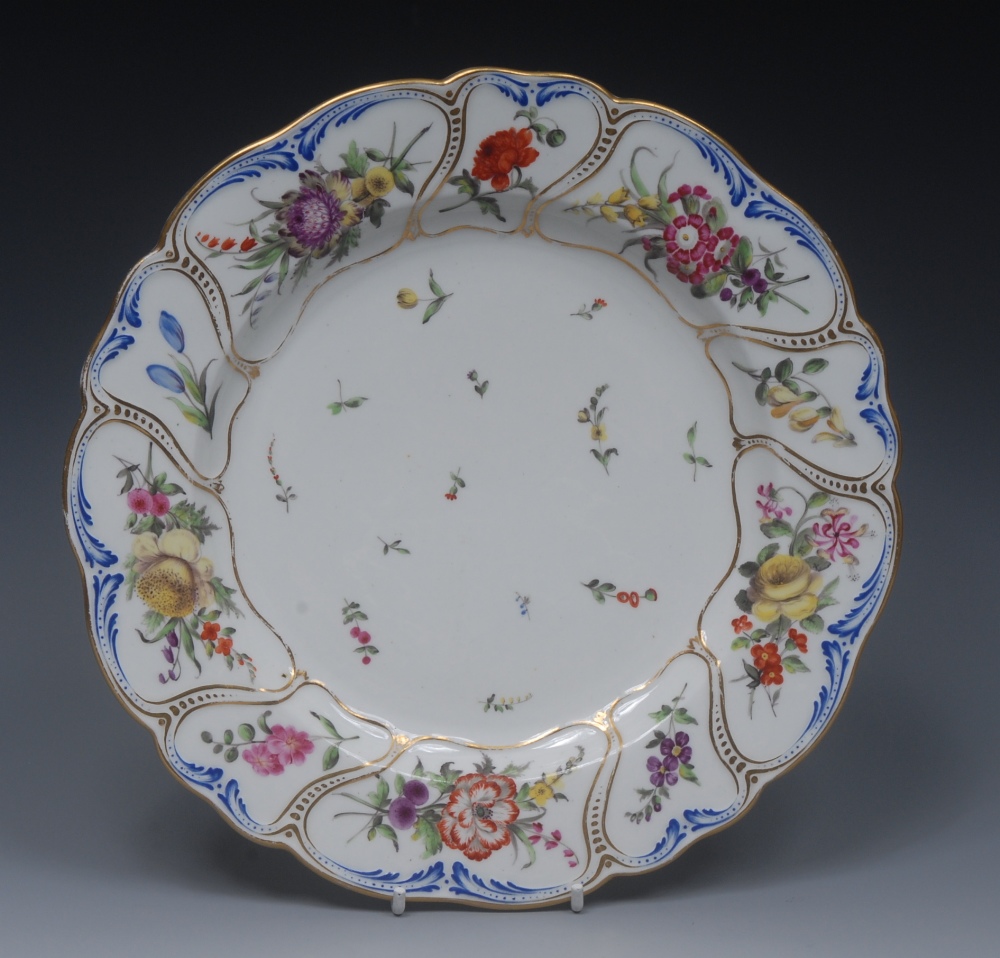 A Derby shaped circular plate, the field with sprigs,