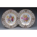 A pair of Copeland Spode shaped circular cabinet plates, decorated by John Arrowsmith,