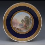 A 19th century Minton circular plate, painted by J E Dean, signed with monogram,