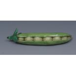 A 19th century English Porcelain pea pod, probably Coalport, naturalistically modelled and painted,