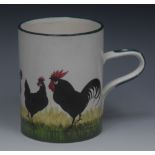 A Wemyss Ware cylindrical mug, painted with black chickens and cockerel, green line borders ,