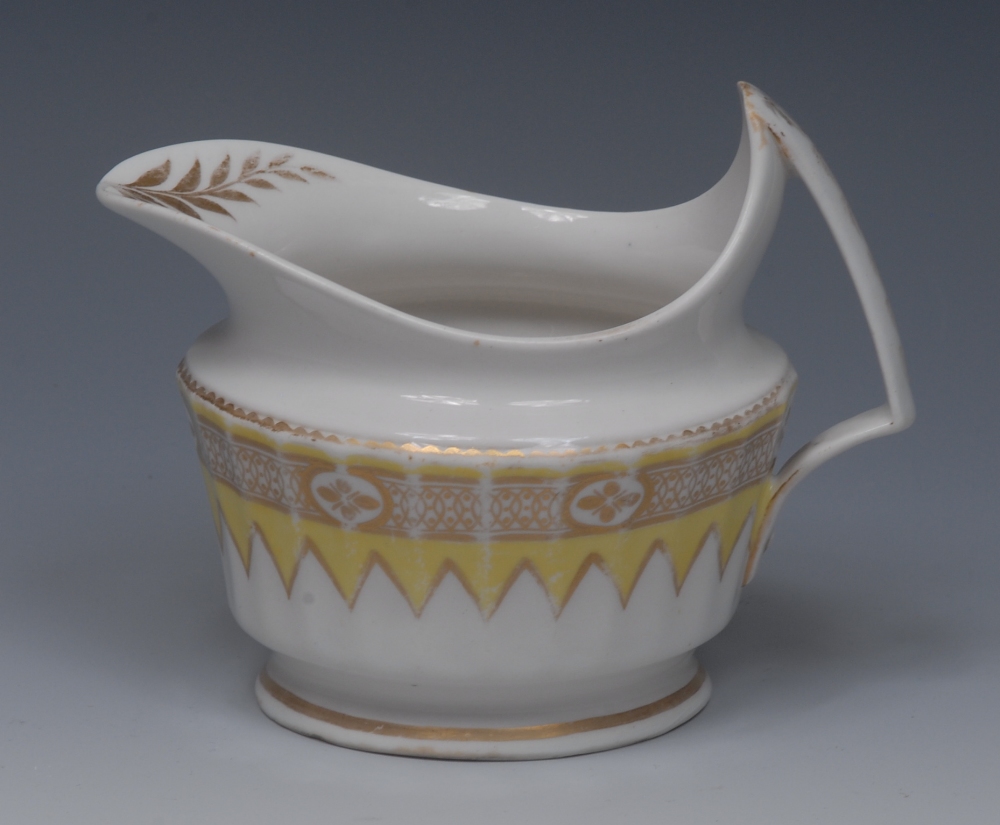 A Derby cream jug, pattern 572, gilt band on a yellow chevron ground,  angular handle, 11cm high,