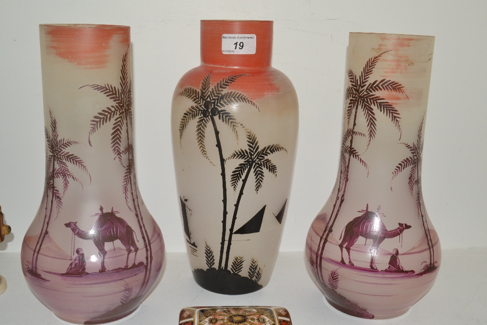 A trio of painted milk glass vases, each painted with Egyptian and Middle Eastern scenes, unmarked,