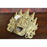 An unusual 19th century Asian gilt bronze incense burner, as a demonic mask, lion paw feet,