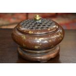 A Chinese gold splash bronze incense burner, pierced cover with knop finial, raised footring,
