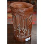 A Chinese bamboo bitong brush pot, carved in relief with figures amongst the canes, 22cm high,