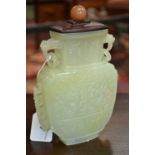 A Chinese pale celadon jade flattened ovoid vase,