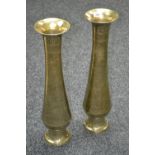 A pair of Persian brass tall slender vases,