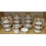 A Sutherland China tea service for twelve decorated with flowers in the Imari pallet,