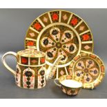 Royal Crown Derby - an 1128 Imari oval teapot; a circular plate; a 6149 Imari cup and saucer;