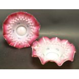 A pair of 19th century Continental glass blush dishes, wavy rim, stipple decoration in relief,