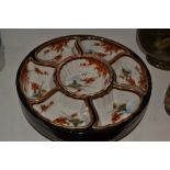 A Japanese Lazy Susan,  with seven bowls, each decorated with mountain and landscape,