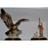 A Capo-di-Monte model, of an eagle, wings outstretched;  a Border Fine Art model,