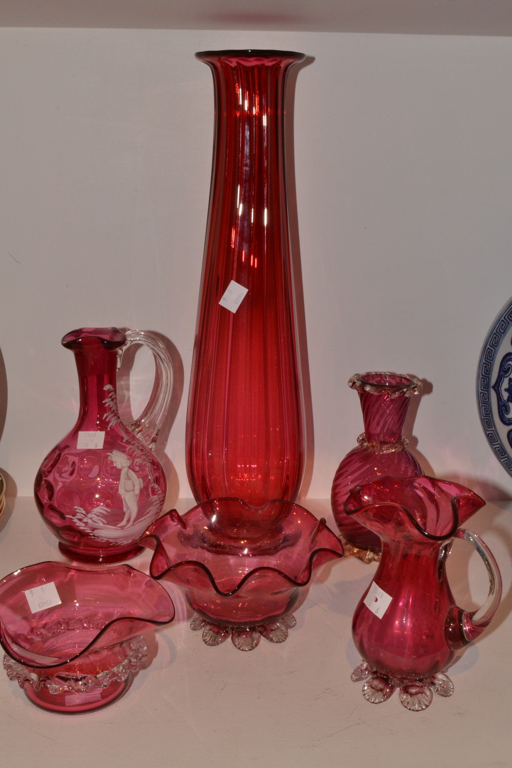 Cranberry Glass - a Mary Gregory cranberry glass ewer, typically decorated with boy and tree,