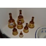 A graduated set of three Wade whisky bells;