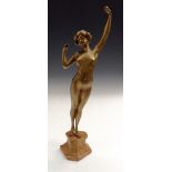 P Philippe, an Art Deco gilt bronze, of a female nude, she stands, her arms stretched upwards,