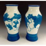 A pair of Chinese cameo glass inverted baluster vases, white glass cased in turquoise blue,