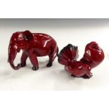 A Royal Doulton flambe elephant, trunk down. 10cm high,  printed marks; another, of a pair of Doves,