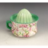 A Shelley Chintz Maytime pattern lemon juicer and squeezer, painted with colourful blossom,