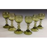 A set of six Austrian sage green glass rummers, high conical foot, spiral stem, decorative knop,