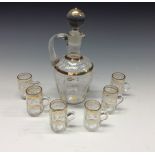 An Edwardian enamelled glass spirit decanter set,
