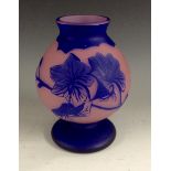 A Loetz cameo glass pedestal ovoid vase, frosted pink glass with dark blue overlay,