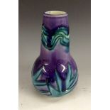 A Minton Secessionist lead-glazed and tubelined vase, shape number 42, impressed mark 3547,