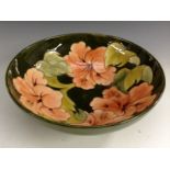 A Moorcroft Hibiscus pattern circular bowl, tube lined with large flowerheads and foliage,