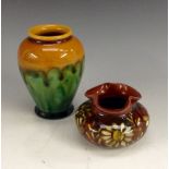 A Linthorpe miniature ovoid vase, glazed in flowing tones of dark orange and green, 8.