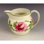 A Wedgwood Pink Rose creamware jug, painted by F. H. Cox with bold roses and foliage, signed F. H.