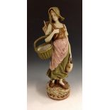 A late 19th century Amphora pottery figure, in the Royal Dux manner, as a farm girl,
