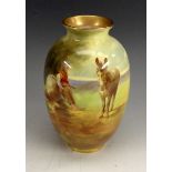 A Royal Doulton ovoid vase, painted with continuous scene of a peasant  boy with his donkey,