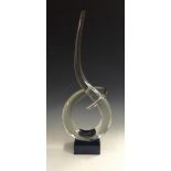 A contemporary Murano clear glass sculpture, Lover's Knot, on a square black glass plinth,