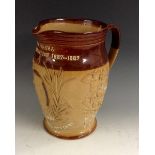 A Doulton Lambeth salt glazed stoneware ovoid jug, in brown and buff, to commemorate the Emin